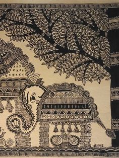 an intricately designed wall hanging with elephants and trees