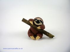 a small toy slotty holding a wooden stick