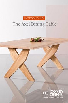 the table is made out of wood and has an x - shaped design on it