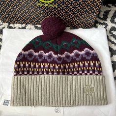 Tory Burch Fair Isle Hat Color: Winter Fairisle Misted Lichen Brand New! Never Used Winter Hat Bundle Up In Our Fair Isle Hat, A Nod To Vintage Apres-Ski Style. Featuring An Engineered Version Of The Iconic Pattern, The Cozy Accessory Is Knit With Pure Merino Wool For Warm And A Natural Feel. Pom-Pom At Crown Fold-Up Brim Engineered Fair Isle Pattern Embroidered Logo Patch Chunky Merino Wool (100% Wool) Tags: Designer, Preppy, Ski, Cold Weather, Wool, Statement, Winter, Fall Apres Ski Style, Fair Isle Hat, Raffia Hat, Cozy Accessories, Ski Fashion, Fair Isle Pattern, Wool Beanie, Pom Pom Hat, Wool Hat