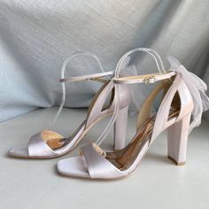 Badgley Mischka Kim Mesh Bow Ankle Strap Block Heel Color: Soft Lavender Purple Women's Size 9 New In Partial Box - Missing Lid "For The Blushing Bride With A Fierce Nature. Stride Towards Your Happily Ever After In Shoes That Empower You With Height And Highlight Your Femininity. Kim Elevates You With Confidence, And A 3 ½ Inch Block Heel. The Tulle Bow At The Back Is Reminiscent Of A Bridal Veil, Bringing Blissful Beauty To Your Look." Specifications Mp6231 Heel Height: 3.54” (90mm) Block Heel Lavender Wedding Shoes, Elegant Lavender Heels For Party, Elegant Lavender Heels For Formal Occasions, Elegant Lavender Ankle Strap Heels, Bejeweled Shoes, Black Evening Shoes, White Heels Wedding, Silver Strappy Sandals, Coquette Kawaii