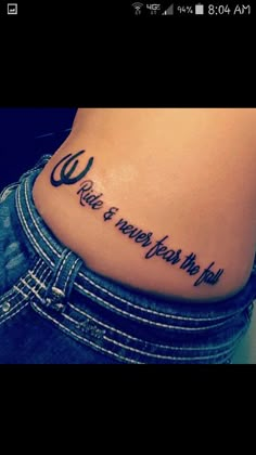 a woman's lower back tattoo with the words love is when you wish to fly