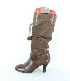 "Vintage Women's Brown Leather & Suede BRONX Pull On Tassel Wrinkle Mid Calf Boots   size -  UK 7 EU 40   Please check measurements    Length from front to back: 10\" ( 25.4 cm )   Width across the widest part of the outer sole: 3.5\" (8.9 cm )   Heel height: 3.1\" (7.9 cm ) 16.755 inches (42.6 cm ) top to floor   They are  14.5 inches (36.8 cm ) around the top ( measured inside )     The boots are used but in good condition, please see all pictures.   ############### *Please note that most of my items are vintage and has therefore been previously used unless stated otherwise. Vintage items will have some degree of wear, bobbling or a musty smell. Please take this into consideration when purchasing. If the item has any defects these will be stated in the listing and I do my very best to de Boots Vintage, Vintage Women, Calf Boots, Mid Calf Boots, Bronx, Boot Shoes Women, Mid Calf, Brown Leather, Vintage Ladies