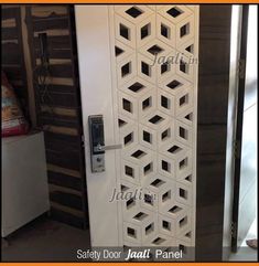 a white door with an intricate design on the front and side panels, in a room