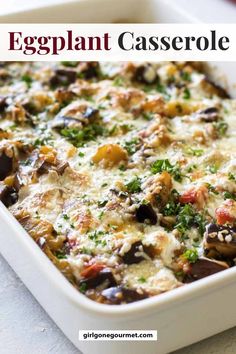 an eggplant casserole in a white baking dish with cheese and herbs