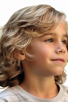 The long wavy hairstyle is perfect for boys who are naturally blessed with waves in their hair. This hairstyle allows you to showcase your hair’s texture while still keeping it manageable. Click here to check out more trendiest boys haircuts for school. Long Hair Styles For Boys Kids, Surfer Haircut Boys, Long Hair Boys Haircut, Long Toddler Boy Haircut, Little Boy Long Haircut, Boys Haircut Long Hair, Long Hair Toddler Boy Hairstyles, Boys Hairstyles Long, Long Curly Boys Haircut