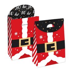 a red and black christmas gift bag with santa clause on it's chest, sitting next to a white background