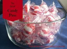 a glass bowl filled with red and white candy