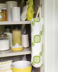 a kitchen cupboard filled with lots of clutter