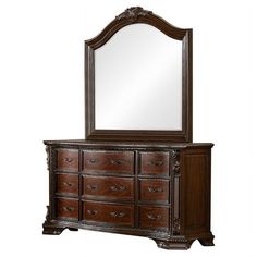 an ornate dresser and mirror are shown against a white background