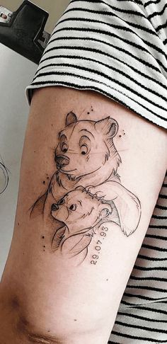 a woman with a bear tattoo on her arm and leg, holding onto another bear