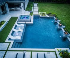 an aerial view of a backyard with a swimming pool