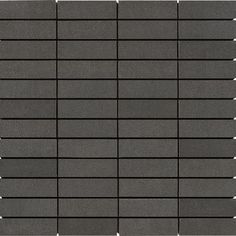 a black tile wall with white dots on it