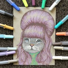 a drawing of a cat with pink hair surrounded by crayons