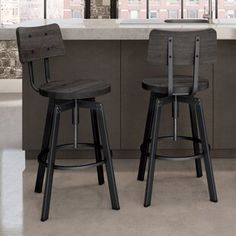 two stools in front of a kitchen counter with a sink and window behind them