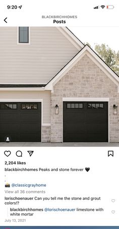 two black garage doors in front of a house