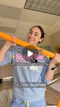 a woman is holding an orange bat in her hand and smiling at the camera with text overlay