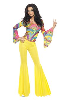 a woman in yellow pants and top posing for the camera with her hands on her hips