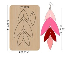 the wooden earrings are designed to look like fish in pink, red and green colors