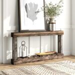 a wooden shelf with plants and pictures on it next to a rug in front of a white wall