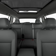 the interior of a car with seats and dashboards in grey color, viewed from the rear