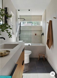 a bathroom with a toilet, sink and bathtub