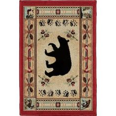 a rug with a black bear on it's back and red trimmings