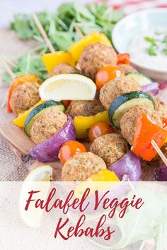 an image of falafel kebabs with vegetables on skewers