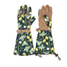 a pair of gloves with yellow flowers on the palm and brown leather cuffs,