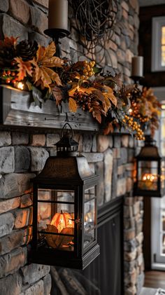 the fireplace is lit with candles and autumn leaves hanging from it's mantel