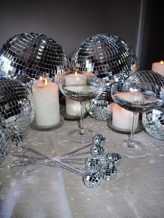 disco balls and candles are on the table