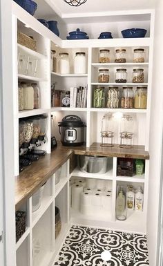 a pantry with lots of shelves and containers