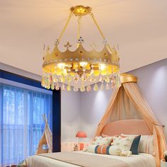 a bedroom with a canopy bed and a chandelier hanging from it's ceiling