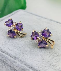 14K Yellow Gold Diamond & Amethyst Clover Leaf Earrings -3/4" Long -5/8" Wide -Six .65 Ct (Each) Heart Amethysts: 5.5mm X 5.5mm -Eight .02 Ct (Each) Round Diamonds: 1mm  -Clarity: SI1 -Color: I Weighs 3.8 grams. Purple Gemstone Accent Earrings For Anniversary, Gold Earrings For Women, Womens Jewelry, Gold Earrings Designs, Jewelry Design Necklace, Amethyst Earrings, Cluster Earrings