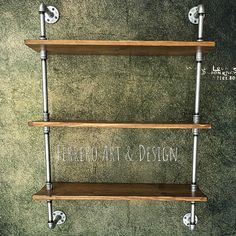 three wooden shelves with metal pipes on them