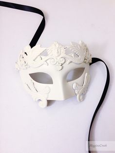 High quality Mask with embellishing is a great addition to any Masquerade Themed party or Mardi Gras. Colors can be customized. Choose custom color option and leave a checkout note with your ideas, we'll be in touch! S H I P P I N G - Processed same day or within 24 hours. 1-2 day guaranteed delivery services offered, add items to cart and click on shipping tab for rates. Pls leave a check out note with your need date & contact number (especially for expedited and custom orders) Msg for deli White Formal Masquerade Mask For Carnival, White Venetian Masquerade Mask For Costume Party, White Venetian Mask For Costume Party, Venetian White Mask For Costume Party, White Venetian Masquerade Mask For Wedding, White Venetian Masquerade Mask For Halloween, Venetian White Masquerade Mask For Halloween, Masquerade Themed Party, Masquerade Masks For Men