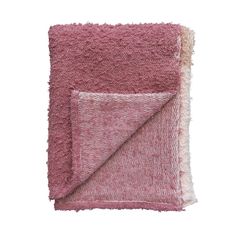 the pink and white blanket is folded on top of each other, with two different colors