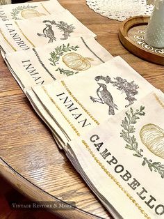 two napkins sitting on top of a wooden table