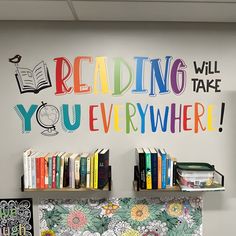 there is a book shelf with books on it in front of a wall that reads reading will you everywhere?