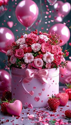 pink flowers and hearts are in a bucket surrounded by balloons, strawberries and confetti