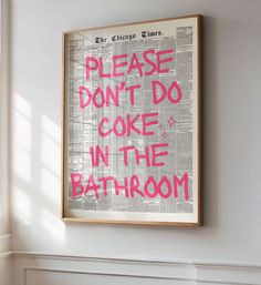 a framed poster that says please don't do cake in the bathroom on a wall