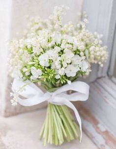 a bouquet of white flowers on a table