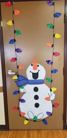 a door decorated to look like a snowman