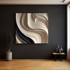 an abstract painting hangs on the wall next to a vase with a plant in it