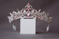 A small pink crown. The crown is perfect for both children and adults due to its small size and weight. Beautiful sparkling tiara with pink crystals in gold or silver plated. Incredible tiara that will look great on the bride. I'm sure you will get a lot of compliments. Height of the tiara - 2"( 5 см) Features: Tiara made with pink crystals and rhinestones Sturdy metal frame Delicate crystal pattern Care instructions: Avoid contact with water Clean with a soft cloth Store in a cool, dry place Pa Cute Pink Hair Accessories, Pink Crowns, Pink Princess Crown, Crystal Wedding Crown, Pink Tiara, Tiara Silver, Crystal Crown Wedding, Headband Crystal, Crown Pink