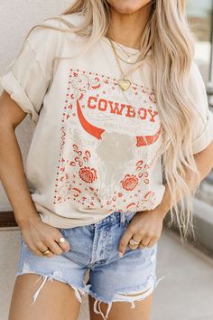 Calling all cowgirls (and cowboys)! 🤠 This tee features a rad cow skull graphic and comes in a comfy, unisex fit. Crewneck and short sleeves keep it casual, perfect for everyday wear. Crew neckline Short sleeves Cow Skull graphic print Unisex fit 100% Cotton Fit and sizing: Measurements are approximate. Length measurements are taken from the top of the shoulder to the bottom hem lying flat. Small - Bust: 43", Waist: 43”, Hip: 43”, Length: 26” Medium - Bust: 45", Waist: 45”, Hip: 45”, Length: 26” Large - Bust: 47", Waist: 47”, Hip: 47”, Length: 26.5” XLarge - Bust: 49", Waist: 49", Hip: 49", Length: 27" See Lily's sizing HERE, she is wearing size Small See Margie's sizing HERE, she wears size Large Concert Ideas, Skull Tee, Skull Graphic, Cow Skull, Large Bust, Shirt Ideas, Small Bust, Cute Shirts