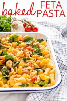 a casserole dish filled with pasta and spinach