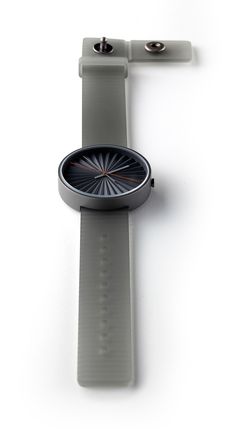 a smart watch sitting on top of a white surface