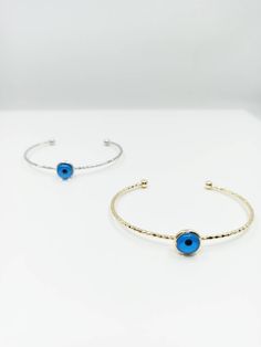 Evil eye bangle bracelet is adjustable. There is one evil eye bead on the evil eye bracelet. Evil eyes are believed to protect the person who carries them. They are also believed to bring good luck and deflect the negative energy. Charm Evil eye bangle can be a perfect gift choice for Christmas or birthday. Blue eye bracelet is also great for daily wear or special occasions. Tarnish resistant, can't be faded in along time. For more evil eye bracelets, click the link below; https://www.etsy.com/s Adjustable Blue Evil Eye Bangle Bracelet, Evil Eye Beaded Bangle Bracelet, Blue Metal Bracelets With Evil Eye, Blue Metal Bracelet With Evil Eye, Blue Evil Eye Metal Bracelet, Blue Metal Evil Eye Bracelet, Blue Evil Eye Bracelets, Blue Eye Bracelet, Evil Eye Bangle