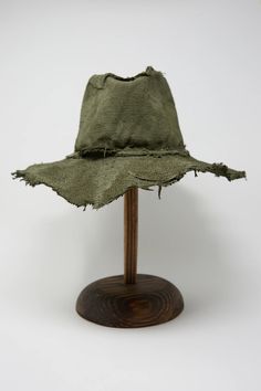 Rustic medium brim hat with raw stitching and edges in a green jute. Each hat is unique and handmade. Made in Italy.  100% Jute.  One Size.  Working tucked away in the country side of Florence, designer Reinhard Plank produces goods with an emphasis on individuality, uniqueness and excellent workmanship. Weathered Clothing, Aging Art, Hat Handmade, Country Side, Ethnic Dress, Tree Drawing, Florence Italy, Brim Hat